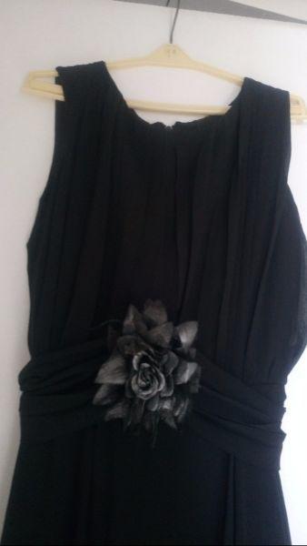 Beautiful black formal dress from a designer it comes with black and silver rose