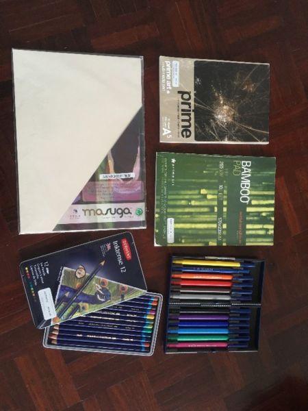 Assorted art supplies - Derwent ink pencils, Staedler markers, multimedia papers