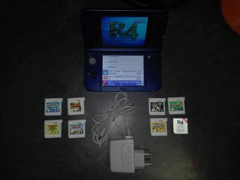 Nintendo 3DS XL + 7 game carriages + R4 SDHC RTS Lite 3 Games on+ 9 downloaded games on console