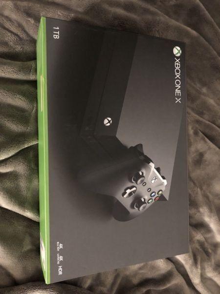 Xbox One X 1tb w/ plug , play charger kit and games