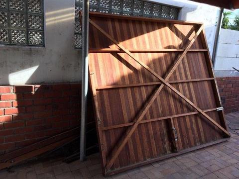 Wooden garage door and metal gate