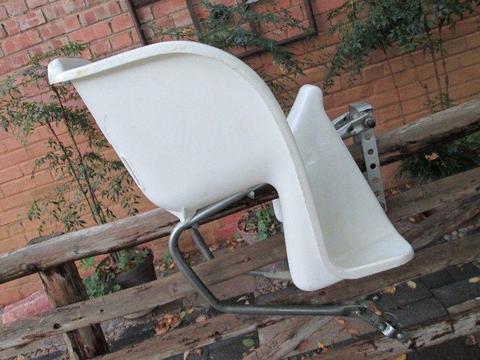 Kid's bicycle seat / carrier, white plastic and metal, used, in good condition