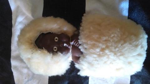 African vintage doll dressed in sheep skin