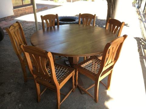 Solid wood round dining table and 6 chairs