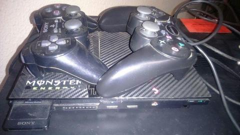 playstation 2 console and 2x controllers