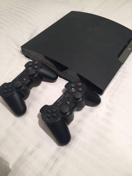 PlayStation 3 with 2 controllers and 5 games