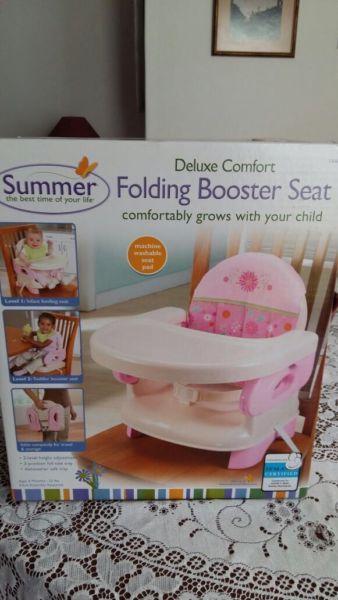 Folding booster seat