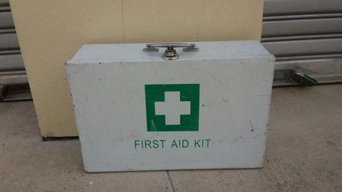 2 First Aid boxes with a few items unused inside one is a wall mount box