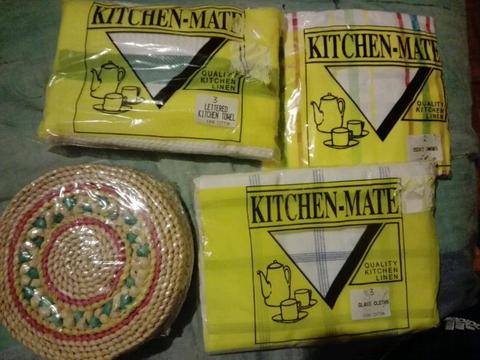 Cotton kitchen towls and straw pot placemates