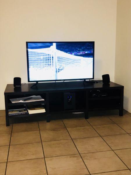 49” Samsung TV, a stand as well as a Wall mount