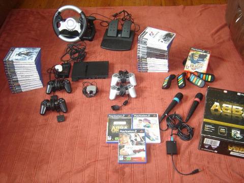 Lovely Original Ps2 mothership combo.. eye toy, singalong, wheel&pedals, buzz +30 games R:4000