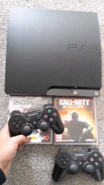 PS3 W/2 GAMES AND 2 REMOTES