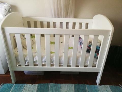 White cot with mattresses