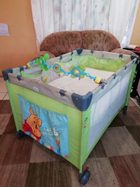 Pooh Bear campcot with mattress, upper level for a newborn and toybar