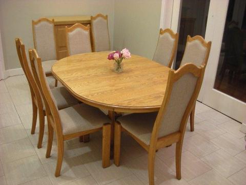 light oak dining table and 8 chairs