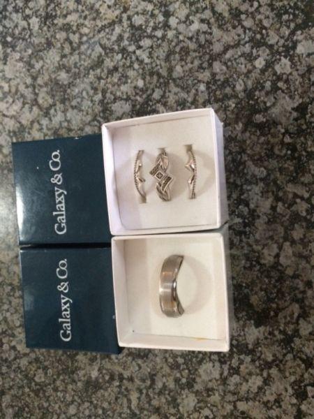 Selling sterling silver ladies wedding set and titanium men’s wedding band. Valuation certificate