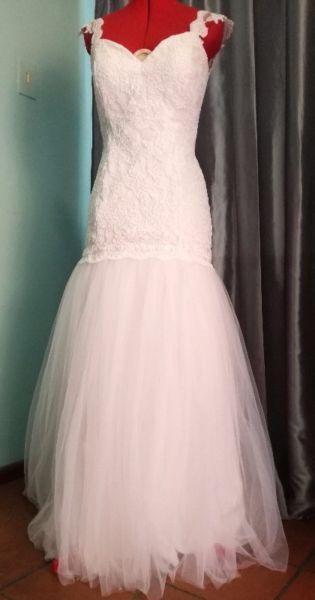 Beautiful white corded lace and tulle wedding dress with low back