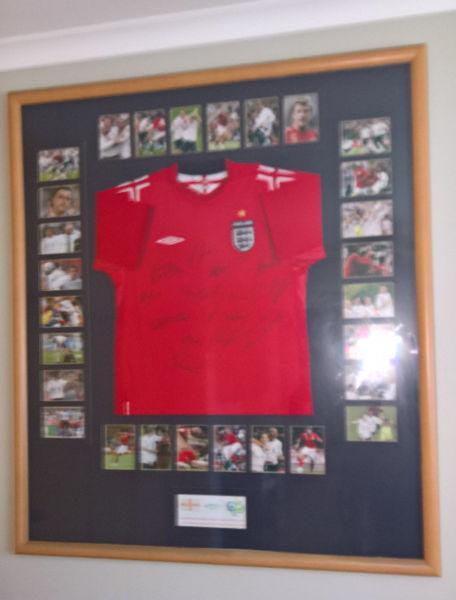 Framed England away football shirt signed by 15 players 2006 world cup