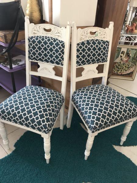 Pair of Ornate Carved Chairs- upholstered in a U & G fabric- R850 each