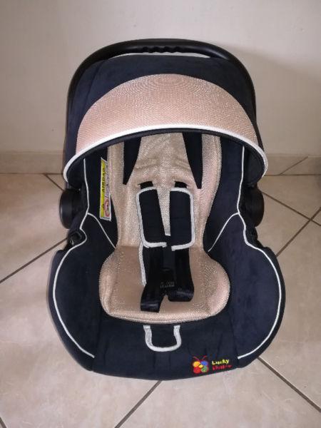 Babies car seat beigh & blue in colour