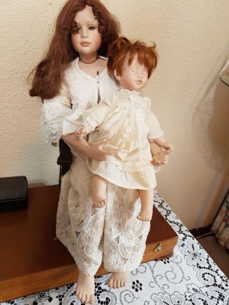 antique doll and her baby dol with little antque chair