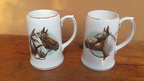 Beautiful pair of ceramic horse tankards