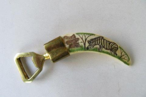 WARTHOG TOOTH BOTTLE OPENER WITH ZEBRAS NO.1 - AS PER SCAN