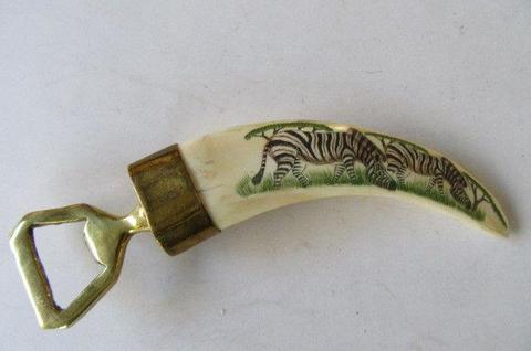 WARTHOG TOOTH BOTTLE OPENER WITH ZEBRAS NO. 2 - AS PER SCAN