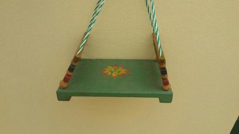 Old Wooden swing seat with painted surface decoration in good useable condition nice for children
