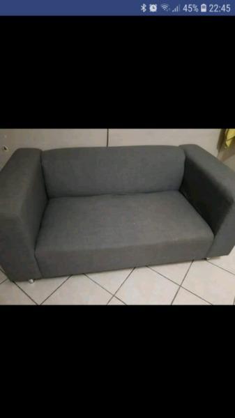Grey 2 seater couch R1500 light brown ottoman R50