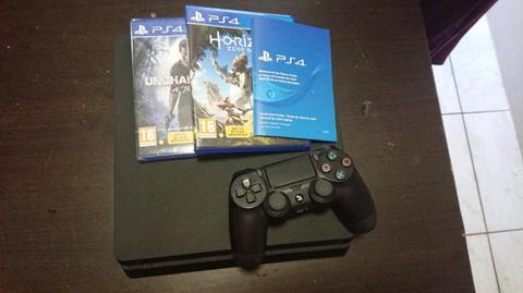 Playstation 4 slim 500gig with one remote and two games