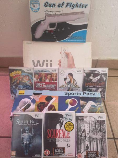 Wii Nintendo console + sports pack + gun+ 7 games for Sale