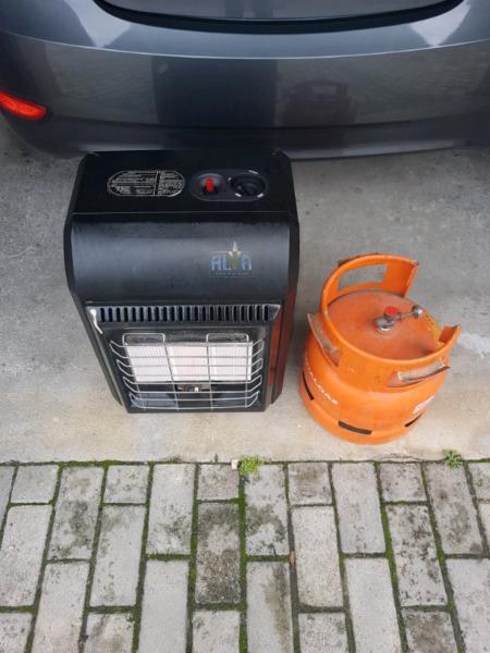I'm selling my full gas cylinder and Alva gas heater like brand new