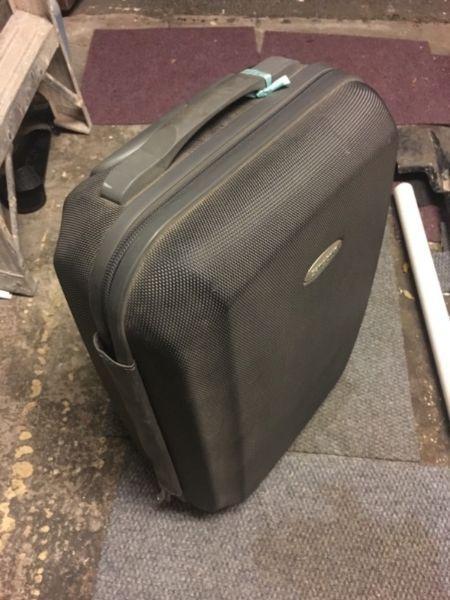 Samsonite carry-on style hard sheel suitcase with two wheel and telescopic handle