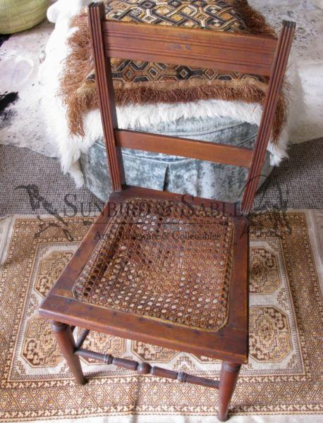 Small wooden vintage chair with rattan seat