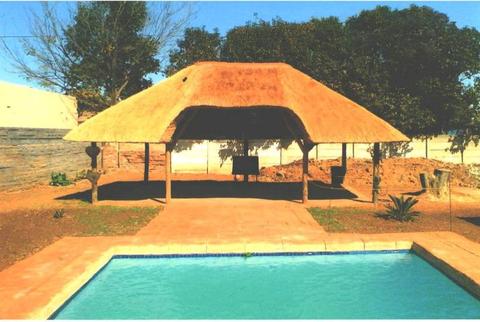 Thatch lapas and swimming pools