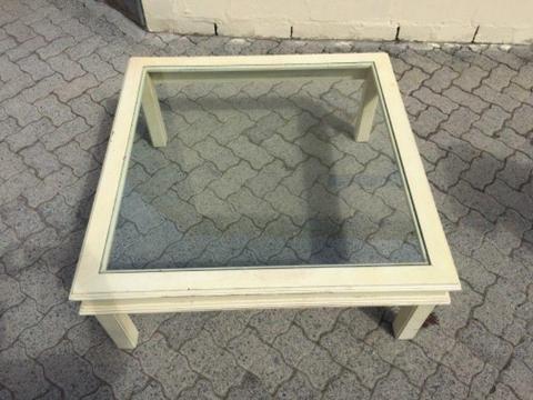 Square cream wooden coffee table with glass top