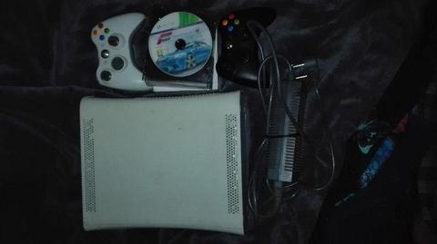 Xbox 360 with wireless controllers and games