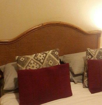 Cane headboard and two pedestals