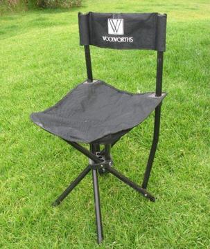 Black Woolworths branded fold out camping chair