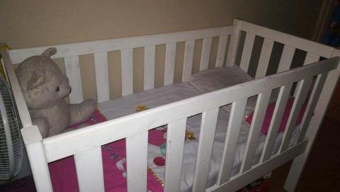 white solid wooden cot includes mattress