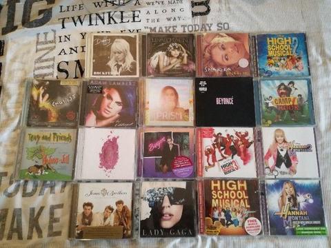 Collection of 18 CDs including Beyonce, Katy Perry, Nicky Minaj, Miley Cyrus, Lady Gaga, Selena Gome
