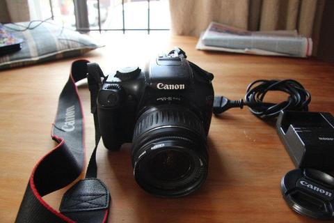 Canon 1100D (Rebel T3) with 18-55mm kit Lens and lens cap