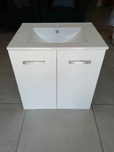 Wall hung bathroom cabinet with sink and mirror
