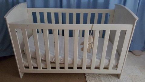 Large solid white wooden cot with mattress