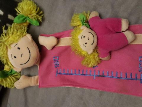 Child's growth chart with detachable doll to record height