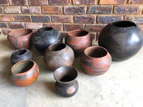 Collection of 9 African handmade clay pots
