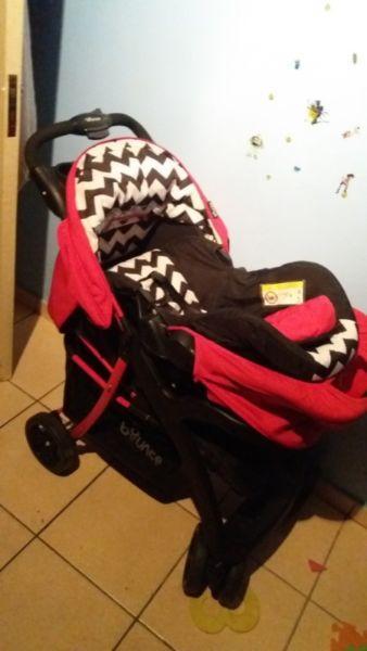 black, red and white baby chair and pram