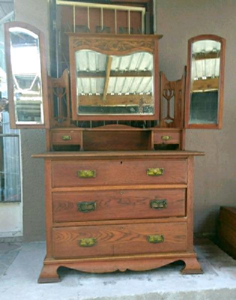 Antique batwing dresser with carved detail