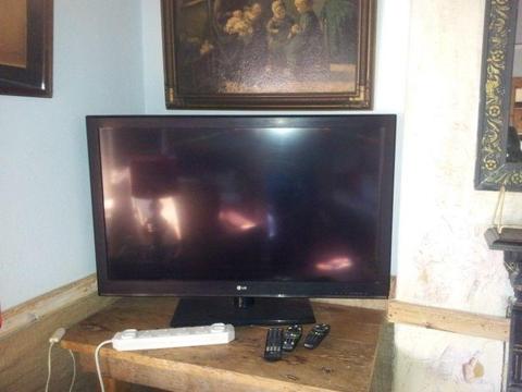 LG 42 in tv with extra speaker stand and Dish
